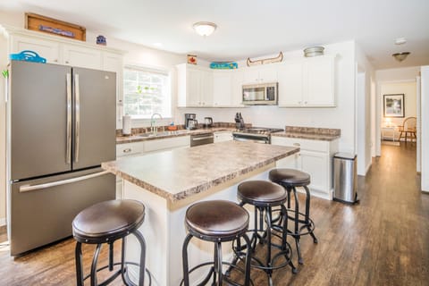 Convenient kitchen island with stylish barstools. 