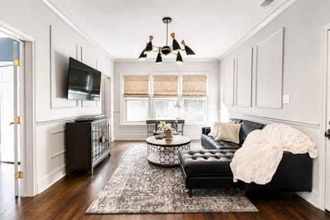 Living room with comfy sectional sofa and smart TV. 