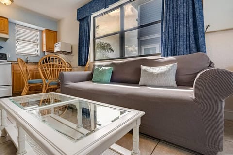 Cozy seating area w/ plush sofa and coffee table, great for relaxing after a day out.