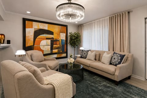 Contemporary design featuring statement artwork and designer lighting