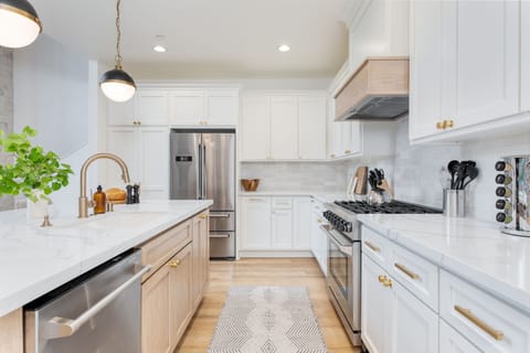 Spacious kitchen with modern appliances and a gas stovetop.