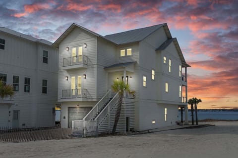 Stunning twilight exterior of Stella Maris showcasing its soundfront setting and coastal glow.