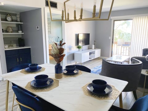 Dining, living space with designated coffee bar.
