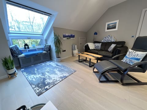 Luxury living room with comfy sofa, designer river table and ergonomic chair