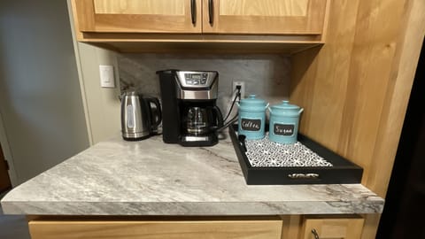 Coffee area that will allow you to grind your own beans. and a hot pot for tea.