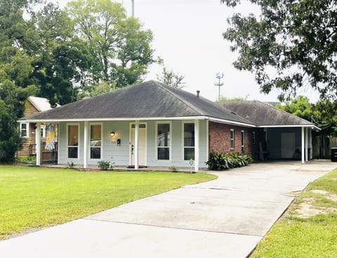 Private driveway with covered carport and plenty of private parking.