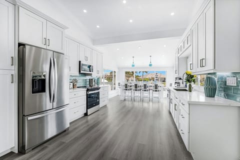 Large Kitchen With Stainless Appliances, Quartz Countertop Unique 10 Seat Island