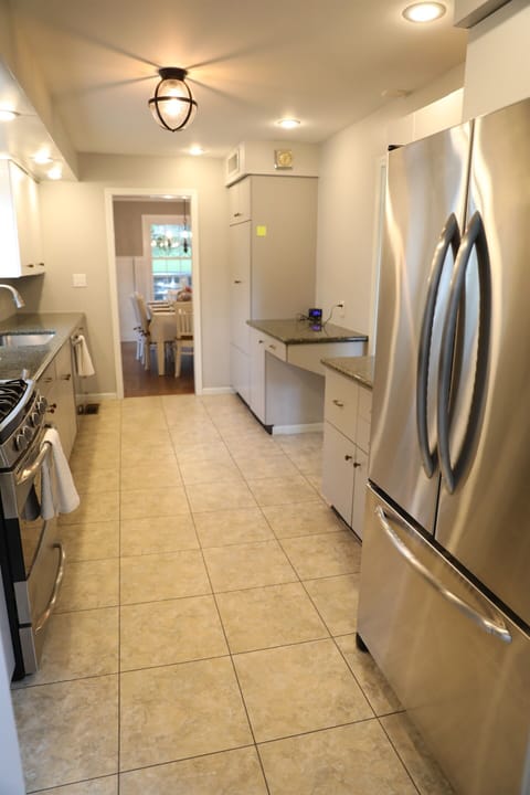 Kitchen showing stove, microwave, sink, dishwasher, pathway to dining room, pathway to dinette, fridge