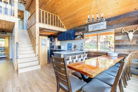 Huge dining table and a breakfast bar to host gourmet meals and gatherings.