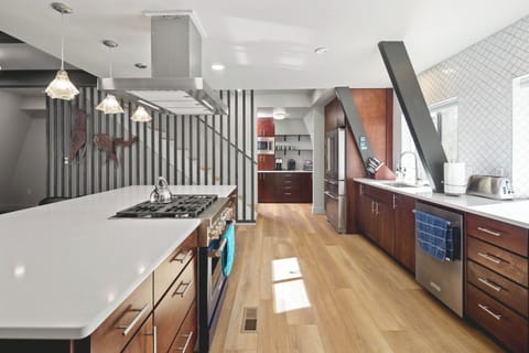 Gourmet kitchen with extra large island gives everyone space to help cook