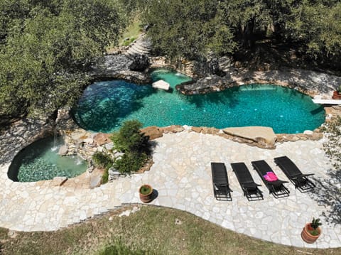 Absolutely amazing country club style 12' pool with a diving board and BBQ area