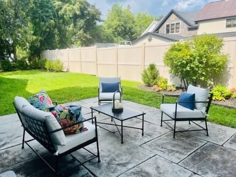 Private Backyard | Stone Patio | Patio Furniture | Fire Pit