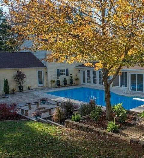 Large pool, fireplace, and fenced in yard.