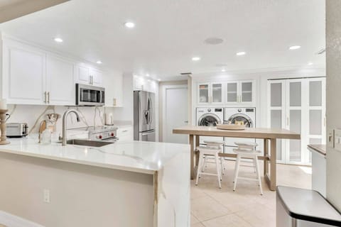 The kitchen boasts a sleek and modern design. Ready for cooking!
