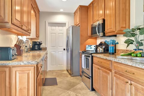 Galley kitchen that leads to bedroom 4 and the laundry room