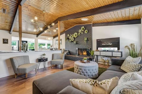 The open layout between the living room, kitchen, and dining room  is perfect for large groups traveling together to enjoy each other's company.