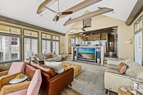 Unwind in style with this spacious living room featuring breath-taking ocean views.