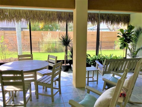 Tiki Patio with table/chairs, seats 6. Swing and rocking chairs. Seats up to 11.