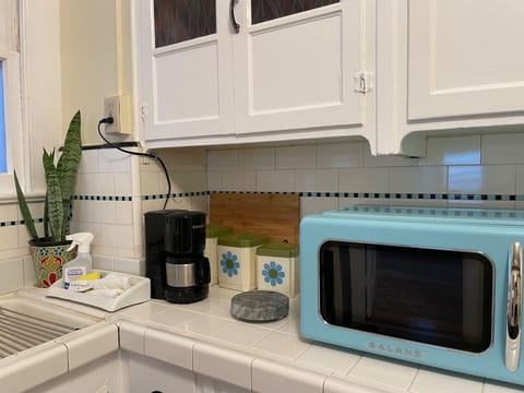 Kitchen: Microwave, and coffee pot
