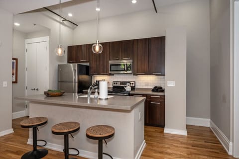 Open Kitchen with stainless appliances - fully stocked glassware/tableware