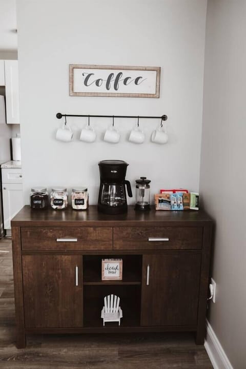 Coffee bar with complimentary snacks, coffee supplies, and more