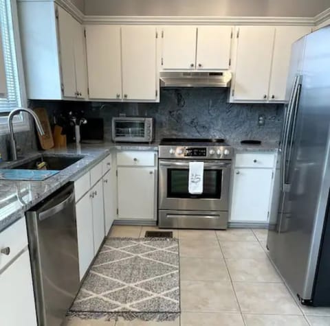 Second floor kitchen,  granite countertops.  Cook without missing a thing!