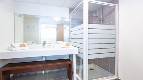 Freshen up in the bathroom after a day of adventure.