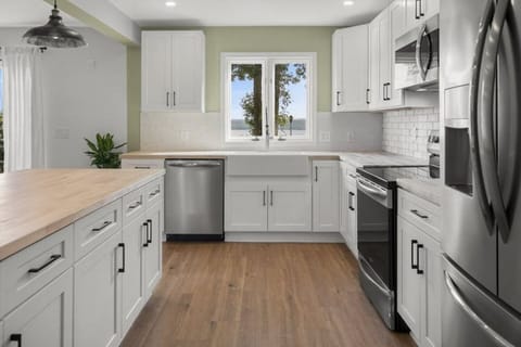 The galley style kitchen offers state of the art appliances and every amenity you will need to cook a unforgettable meal.