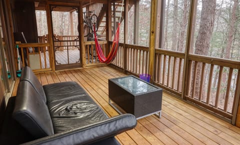 Downstairs waterproof screened deck w/ couch, (2 chairs & 2 tables not pictured