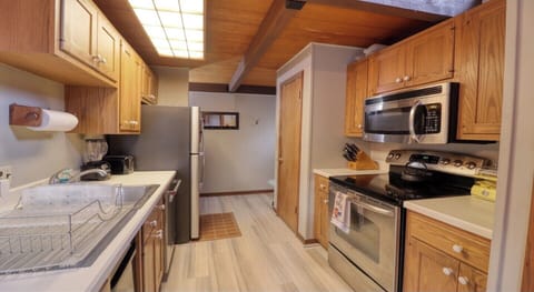 Stainless steel appliances, teash compactor and icemaker in freezer