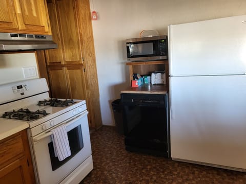 Also Kitchen shows stove, microwave, dishwasher & refrigerator.