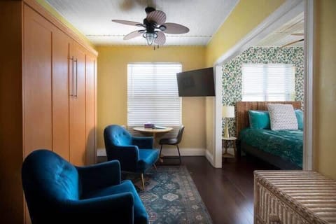 Living Room seating area with queen murphy bed 50' smart tv