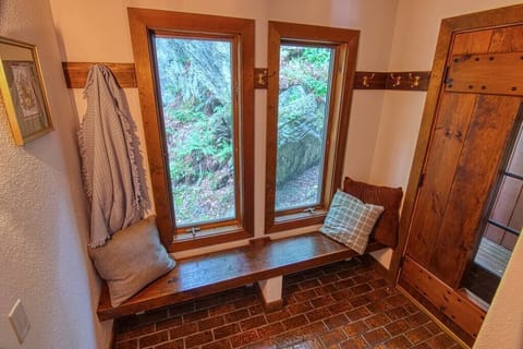 Sitting area with a view of the mountain rocks the house is built into. 
