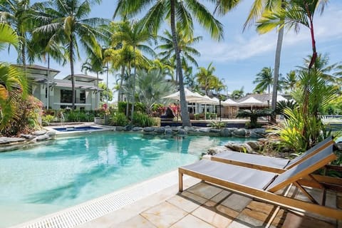 Immerse yourself in the Far North Queensland tropical vibes while lounging by the resort's pool.