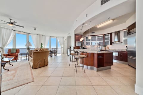 Imagine yourself in this high-end luxury condo, where the open layout flows effortlessly from the well-equipped kitchen to the spacious living and dining areas, all while being just a stroll away from Flora-Bama.