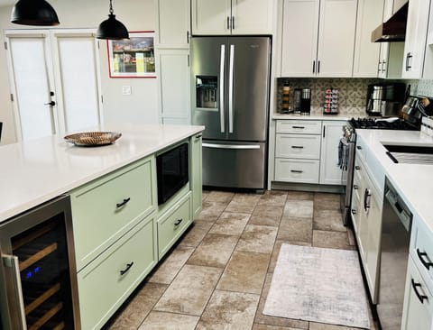 Dishwasher, Gas Stove/Oven, Large Refrigerator, Wine Fridge.