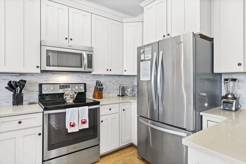 full kitchen with bar seating and dining area