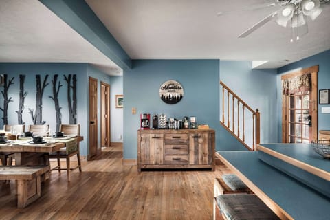 The cabin’s central hub—easy gathering space with room to spread out, unwind, and head upstairs.