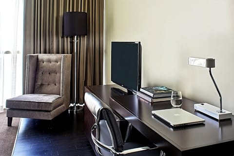 Catch up on emails at a sleek desk with natural light.