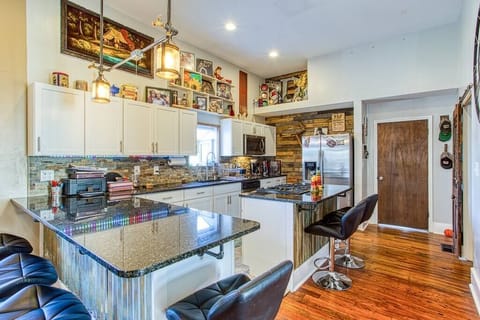 Granite counter tops and plenty of bar seating for entertaining, gas stove