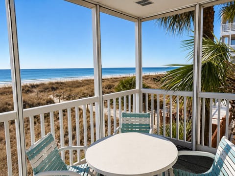 Screen Porch corner unit amazing views of the ocean waves.