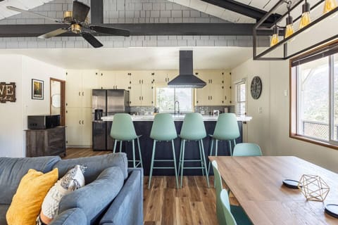 Large dining table seats 6 and breakfast bar seats 4. Table is also perfect for playing cards or games :)