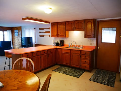 Kitchen and dining area. Please note: no dishwasher