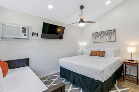 The tiny home sleeps three with a queen bed and daybed!