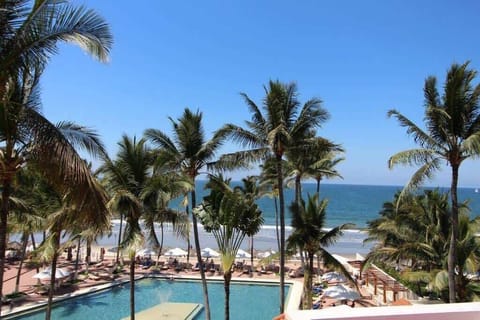Shared resort pool with sun loungers