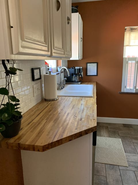 Butcher block counter tops and porcelain tile floor
