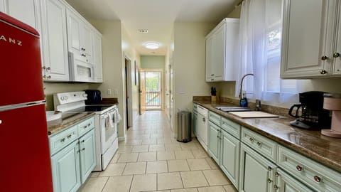 Fully equipped modern kitchen with retro refrigerator