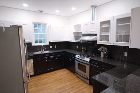 Kitchen with all the appliances and basic pantry items