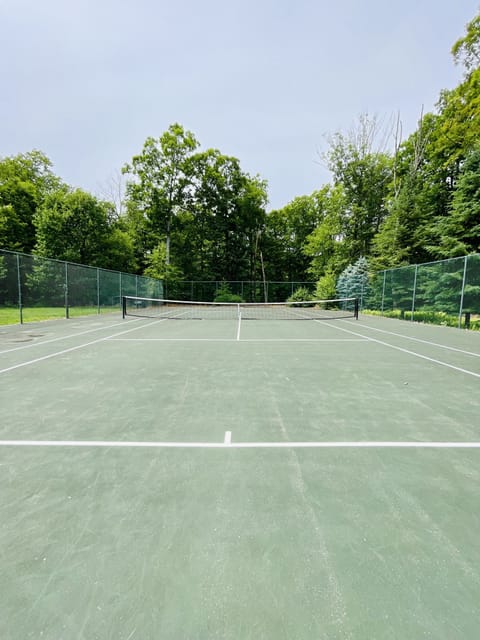 Private tennis court on the property for guest use