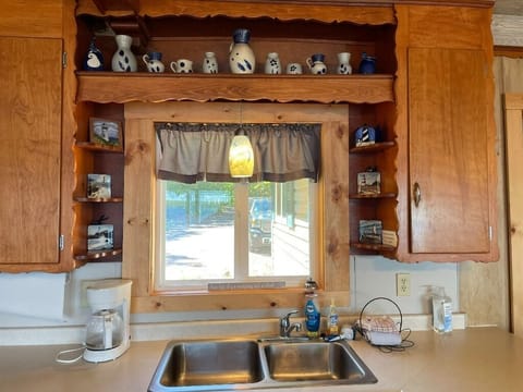 Kitchen sink with a view of parking lot